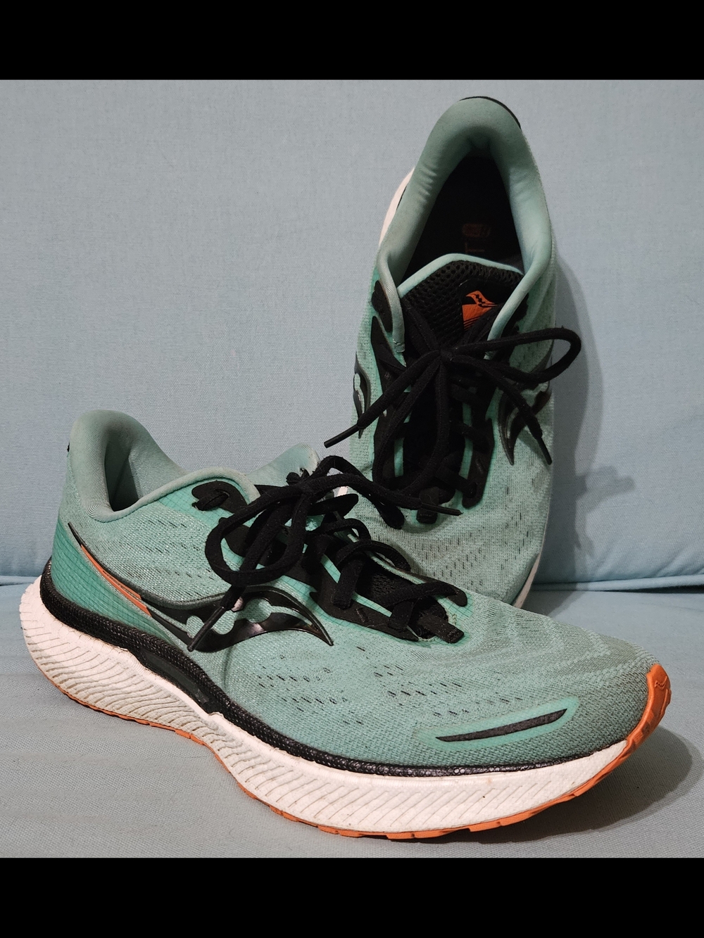 Saucony Green Running Shoes with Orange Accents